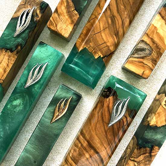 Mezuzah cases in green color of Sea of Galilei